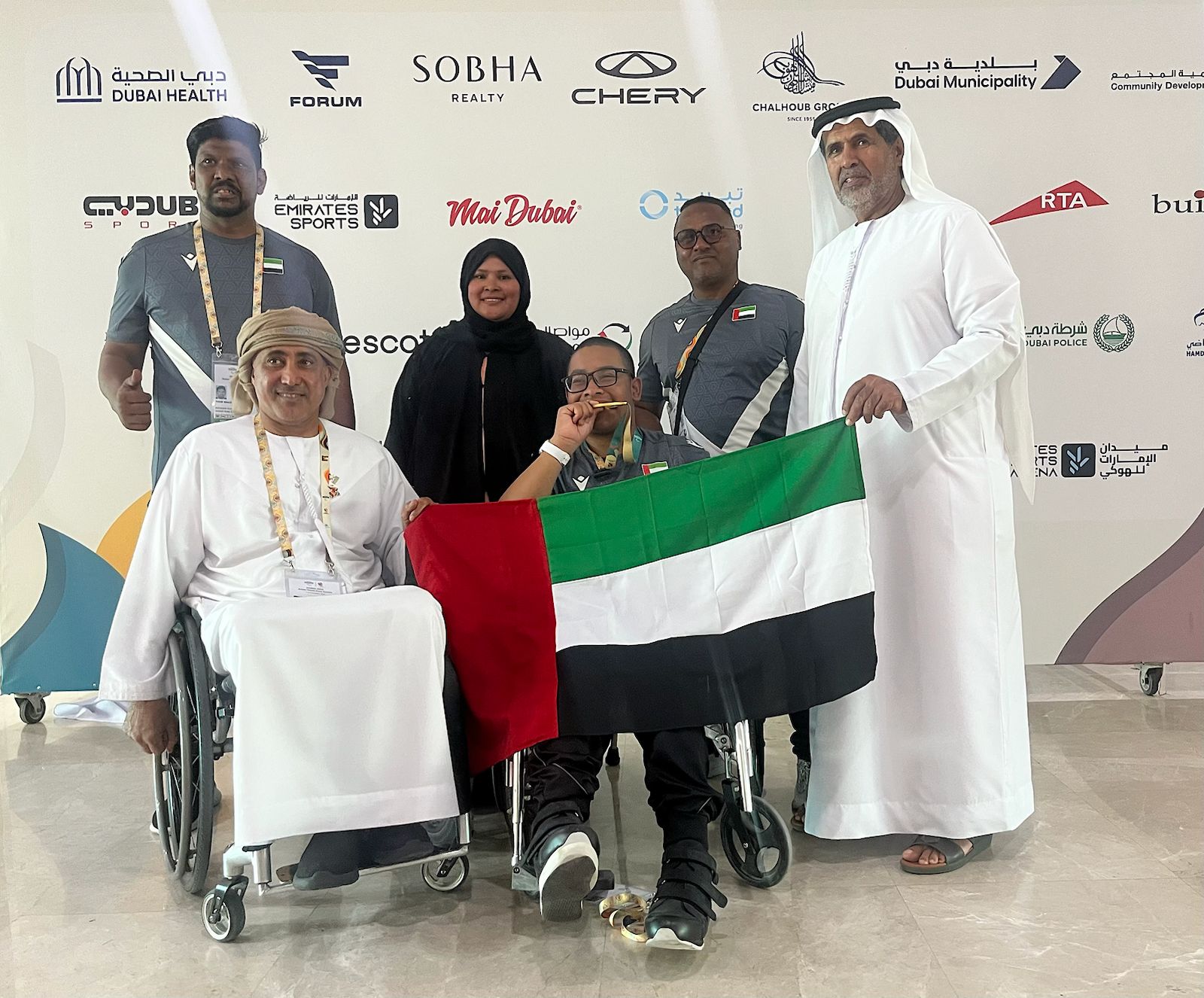Humaid Alblooshi alongwith UAE Paralympic Committee President Mohammed Fadel Al Hameli and his family after taking his medal.