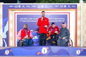 UAE's Mohammed Youssef Othman (centre) poses with the gold medal along with Director of Championships Majid Al-Usaimi at the medals presentation of 17th Fazza International Para Athletics Championships